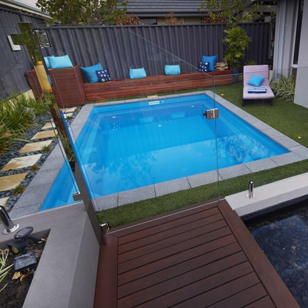Billabong Plunge 6.5m installed with surrounds completed including coping tile, turf and glass fencing gate entry
